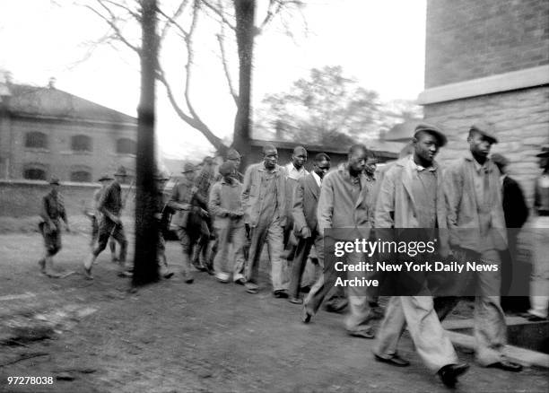 Scottsboro Case - National Guardsmen bringing up the rear, colored men, defendants in famouse Scottsboro case, march to courthouse in Decatur,...