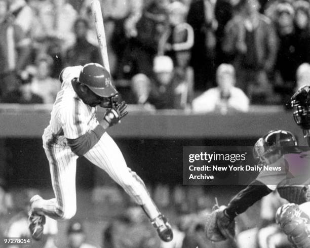 Mets Mookie Wilson avoids getting hit by pitch thrown by the Boston Red Sox reliever Bob Stanley in 10th inning, tying run scored on play in Game Six...