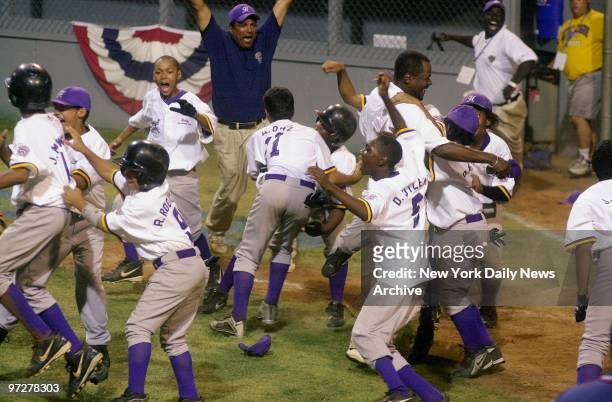 The Harlem Little League team erupts with joy after coming back from a 4-0 deficit to beat Bethlehem, Pa., in extra innings at the 16th annual Little...