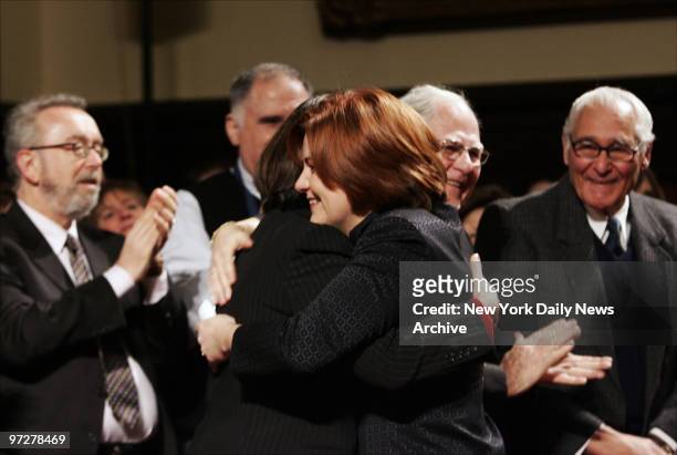 Councilwoman Christine Quinn hugs her partner, Kim Catullo, before being elected to be the first woman and first openly gay person to head the City...