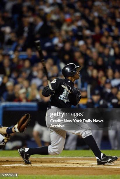 Florida Marlins' center fielder Juan Pierre leads off Game 6 of the World Series with a popout to New York Yankees' Derek Jeter at Yankee Stadium....