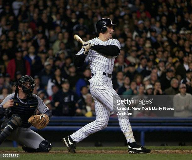 New York Yankees' Paul O'Neil raps out a two-run single during the Yanks' six-run seventh inning against the Seattle Mariners in Game 6 of the...