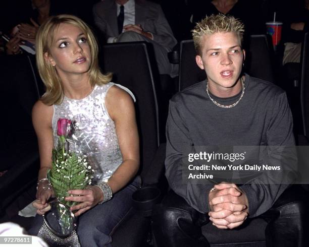 Britney Spears sits at a screening of "Drive Me Crazy" at Union Square Theater with Robbie Carrico.