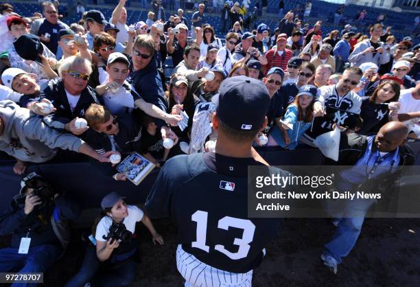 New York Yankees 3rd baseman Alex Rodriguez signs autographs during Saturday workout., Spring Training 2009.