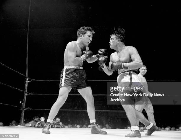 Jake LaMotta and Frenchy Villemain appear to be glaring at each other - with grimaces - in fifth round of Garden fight. Actually, Robare has just...