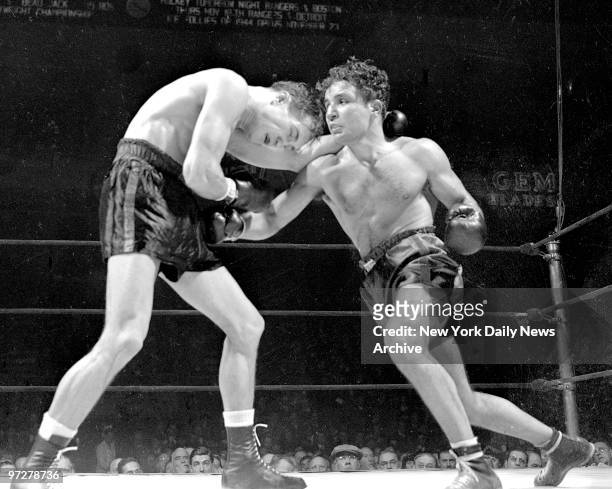 Jake LaMotta throws a right and gets ready with a left in bout against Fritzie Zivic