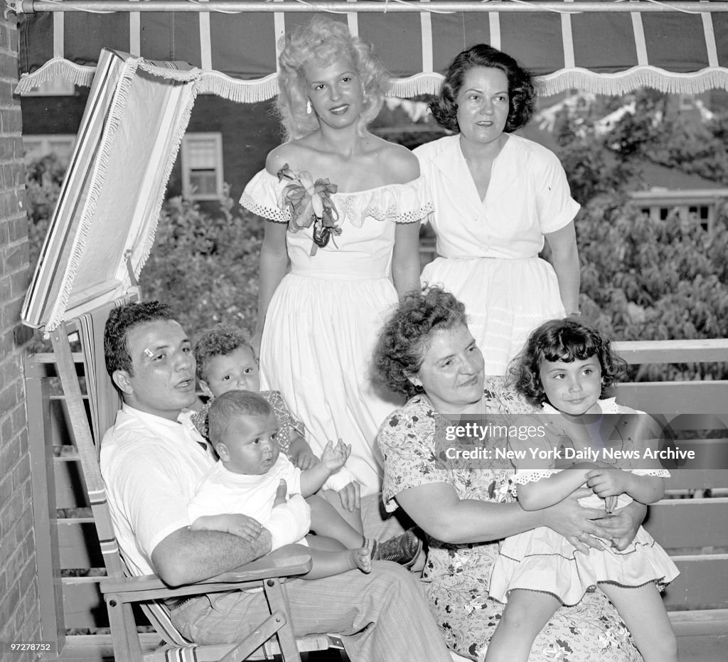 Jake LaMotta holds 2-year-old Jackie and Joe, 8 months, as h