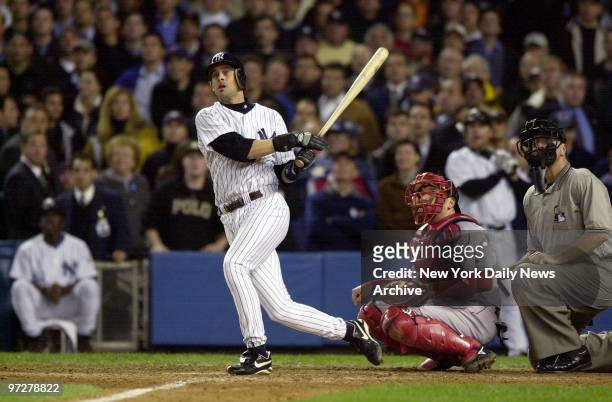 New York Yankees' Aaron Boone hits a solo home run in the 11th inning of Game 7 of the American League Championship Series against the Boston Red Sox...