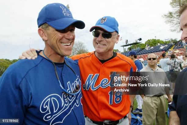 Los Angeles Dodgers' manager Jim Tracy and his New York Mets' counterpart, Art Howe, enjoy a friendly get-together before a game at the Dodgers' Vero...