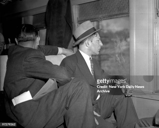 Louis Buchalter, on his way to Leavenworth, Kansas. Here he is on train.