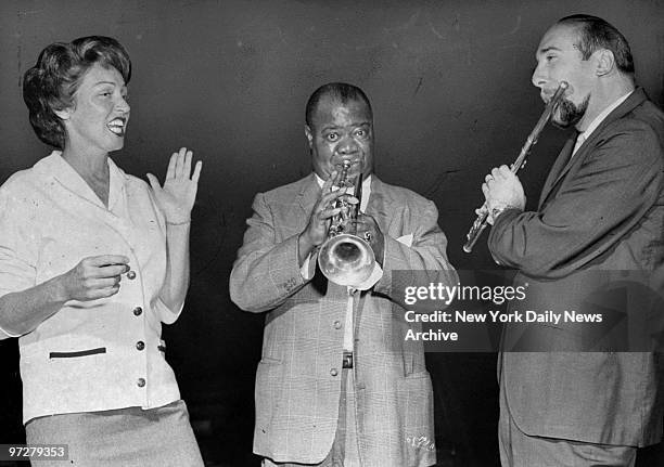 Louis Armstrong, Anita O'Day and Herbie Mann warming up for the Daily News Jazz Festival, at Madison Square Garden.