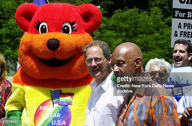 Bronx Borough President and mayoral hopeful Fernando Ferrer meets up with the Pride Bear as he marches in the Bronx Gay Pride Parade along the Grand...