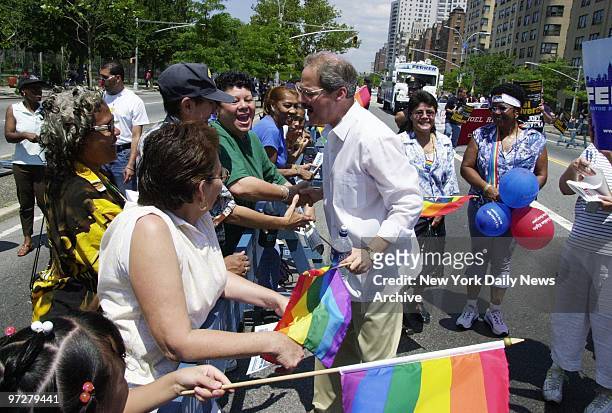 Bronx Borough President and mayoral hopeful Fernando Ferrer takes a break from marching to chat with onlookers at the Bronx Gay Pride Parade along...