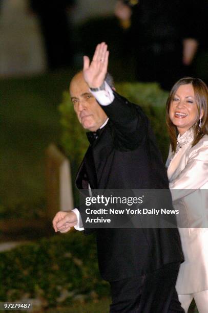 Former New York City Mayor Rudy Giuliani waves as he and wife Judith arrive at the Episcopal Church of Bethesda-by-the-Sea in Palm Beach, Fla., for...