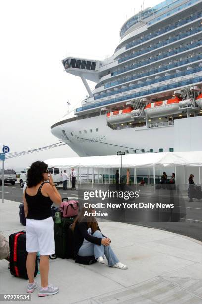 Crew members wait to board the Crown Princess at the Brooklyn Marine Terminal in Red Hook, where it is docked after arriving from Port Canaveral,...