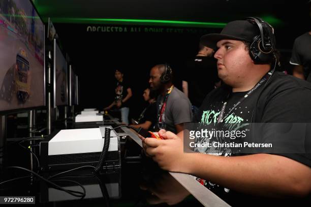 Game enthusiasts and industry personnel play 'Forza Horizon 4' during the Electronic Entertainment Expo E3 at the Microsoft Theater on June 12, 2018...