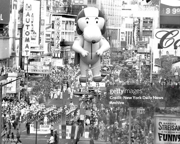 The Kilgore, Texas band struts its stuff and so does Snoopy as the 43d annual Macy's Thanksgiving Day Parade moves through Times Square.