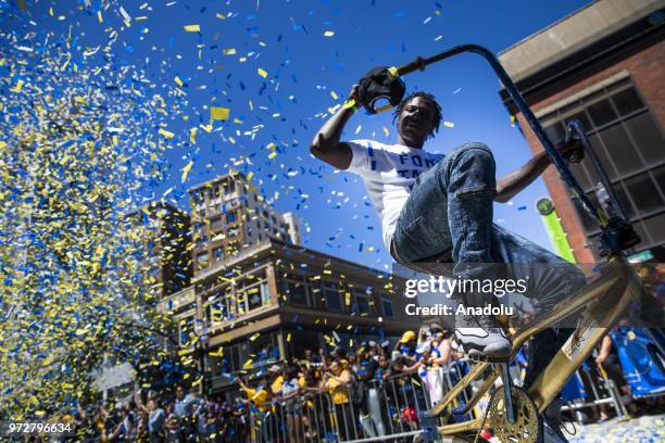 Member of the Original Scraper Bike Team from Oakland, California rides along the parade route in memory of Paul "Tall Paul" Brown during the Golden...