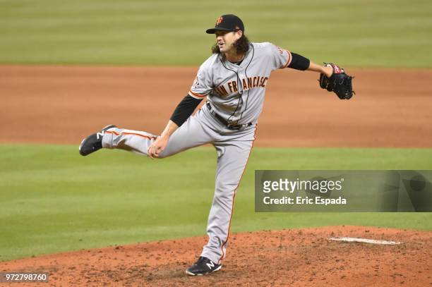 Cory Gearrin of the San Francisco Giants throws a pitch during the eighth inning against the Miami Marlins at Marlins Park on June 12, 2018 in Miami,...