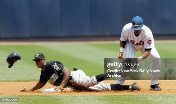 Florida Marlins' outfielder Juan Pierre steals second base past New York Mets' shortstop Jose Reyes in the first inning of game at Shea Stadium....