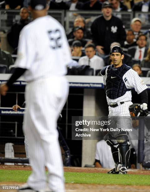 New York Yankees against the Minnesota Twins in Game 1 of the American League Division Series at Yankee Stadlium. Jorge Posada looks at CC Sabathia...