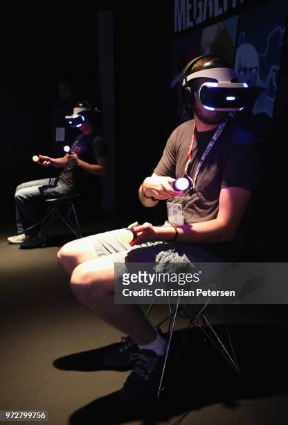 Game enthusiasts and industry personnel test Sony Playstation VR games during the Electronic Entertainment Expo E3 at the Los Angeles Convention...