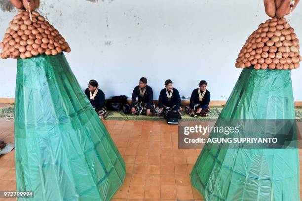 This picture taken on June 12, 2018 shows palace servants of the Sultan of Yogyakarta taking part in the Tumplak Wajik ceremony, to prepare the...