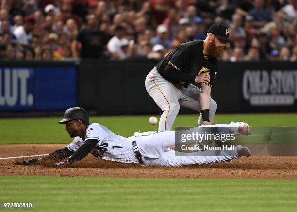 Jarrod Dyson of the Arizona Diamondbacks slides safely into third base as Colin Moran of the Pittsburgh Pirates cannot come up with the throw from...
