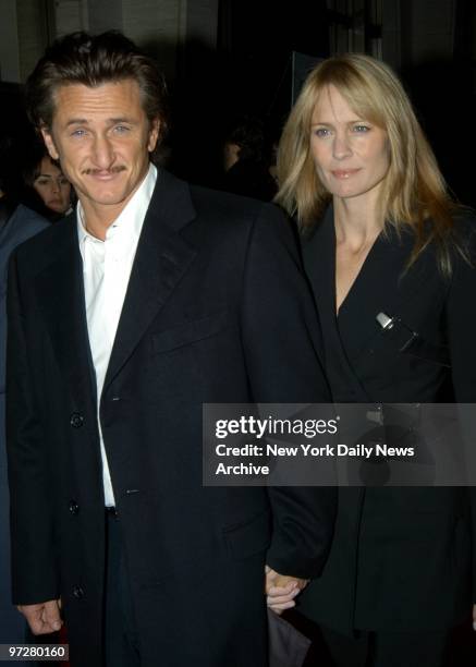 Sean Penn and wife Robin Wright Penn arrive at Avery Fisher Hall for the closing of the 41st New York Film Festival, featuring the film, "21 GRAMS."