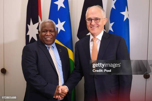 Prime Minister of the Solomon Islands Rick Houenipwela and Australian Prime Minister Malcolm Turnbull shake hands ahead of a bilateral meeting at...