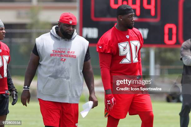 Defensive line coach Brentson Buckner and Jason Pierre-Paul watch the action on the field during the Tampa Bay Buccaneers Minicamp on June 12, 2018...