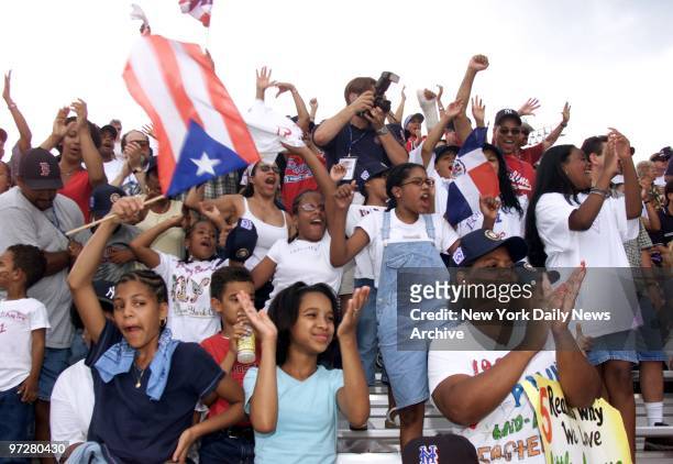Bronx fans cheer on the Rolando Paulino All-Stars as they play against Florida team Apopka National during the first game of the 2001 Little League...