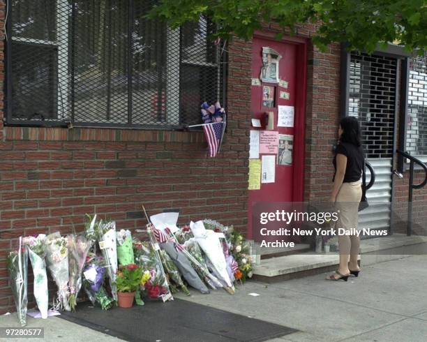 Flowers have been placed in memory against the wall and sympathy notes have been attached to the door of the Bergin Hunt and Fish Social Club in...