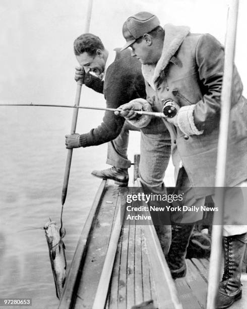 Lou Gehrig and Babe Ruth bag a fish.