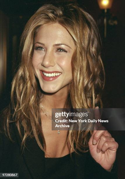 Jennifer Aniston arrives for premiere of movie "Meet Joe Black" at the Ziegfeld Theater.