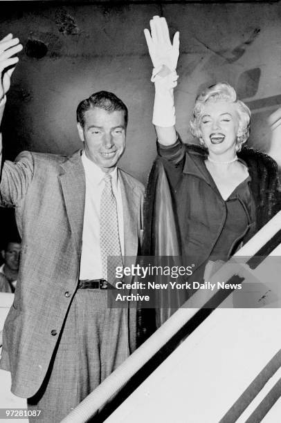 Joe DiMaggio and Marilyn Monroe at Idlewild International Airport.
