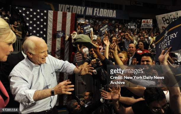 Crowds cheer at a midnight rally for Presidential candidate Senator John McCain at the Bank United Center, in Miami, Florida