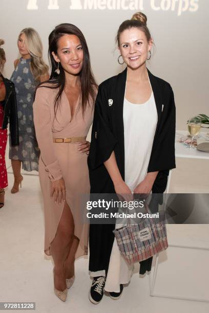 Viet N'Guyen and Bell Downie attend the International Medical Corps Summer Benefit at Milk Studios on June 12, 2018 in New York City.