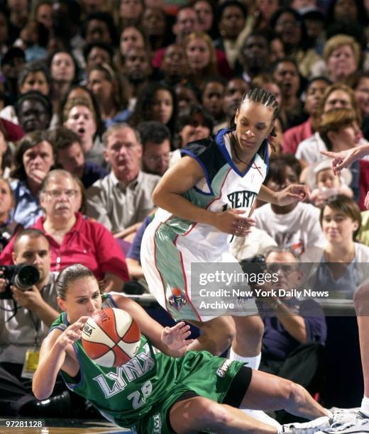 The Minnesota Lynx' Svetlana Abrosimova pounces on the ball as New York Liberty's Teresa Weatherspoon circles her during the first quarter of game at...