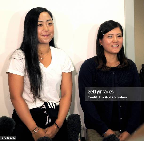 Eri Hozumi and Makoto Ninomiya speak to media reporters on arrival at Haneda Airport on June 12, 2018 in Tokyo, Japan.