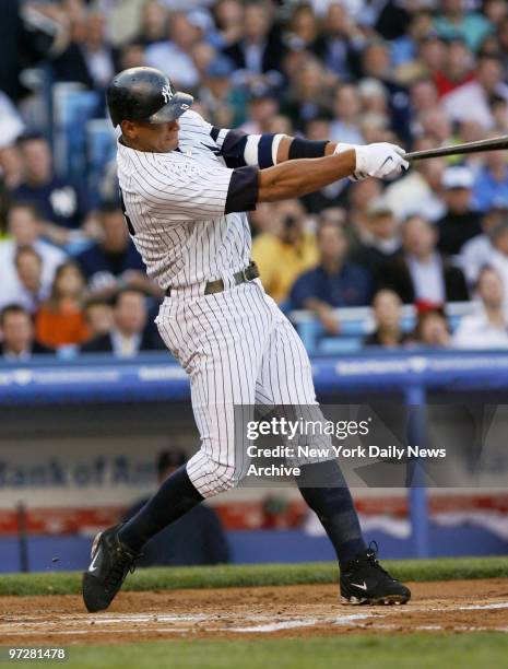 New York Yankees' Alex Rodriguez hits a two-run homer to left in the first inning of a game against the Boston Red Sox at Yankee Stadium. The Yanks...