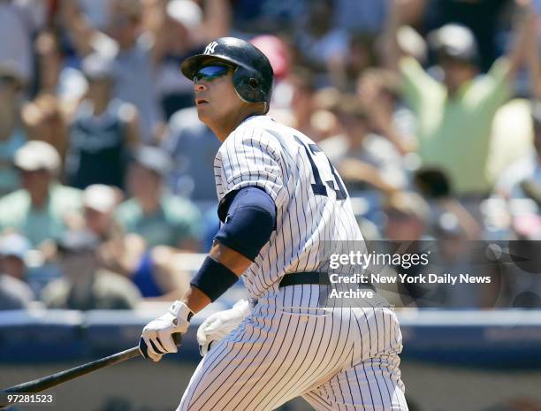 New York Yankees' Alex Rodriguez hits a two-run homer to left-center in the first inning of a game against the Chicago White Sox at Yankee Stadium....