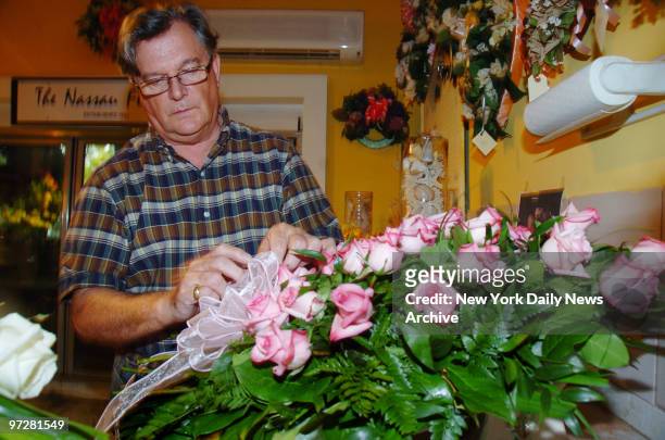 James Whitehead of the Nassau Florist prepares flower arrangements for tomorrow's funeral for the late Anna Nicole Smith. She will be buried at...