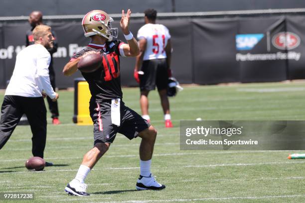 San Francisco 49ers Quarterback Jimmy Garoppolo starts warming up on June 12, 2018 at the SAP Performance Facility in Santa Clara, CA.