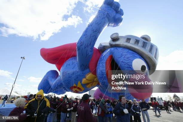 Macy's crew takes the new Super Grover character balloon for a test flight in the parking lot at Giants Stadium. The monumental Muppet will be...