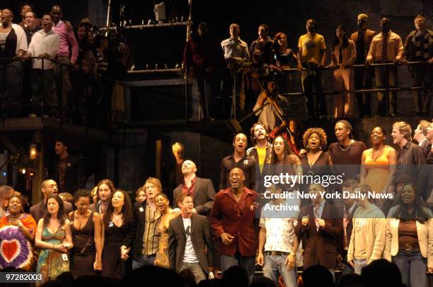 Former and current cast members of "Rent" get together on stage during the curtain call for the 10th anniversary celebration of the hit Broadway show...