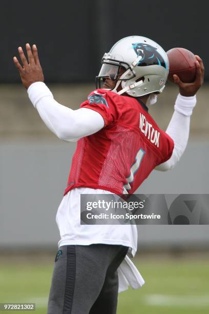 Cam Newton throws a pass during Carolina Panthers minicamp on June 12 at the Carolina Panthers practice facility in Charlotte, N.C.