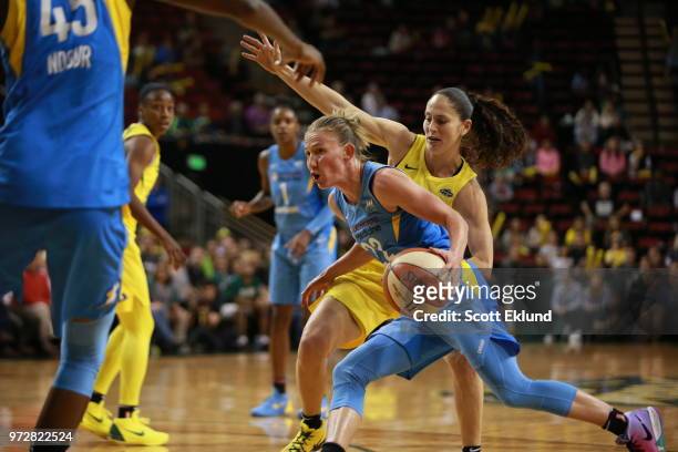 Guard Courtney Vandersloot of the Chicago Sky handles the ball during the game against the Seattle Storm on June 12, 2018 at KeyArena in Seattle,...
