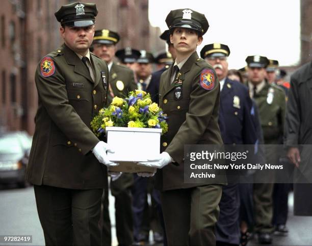 Nassau County police officers bear the casket of Baby Valentine Hope into St. Bartholemew's Church for a mass and funeral service. More than 50...