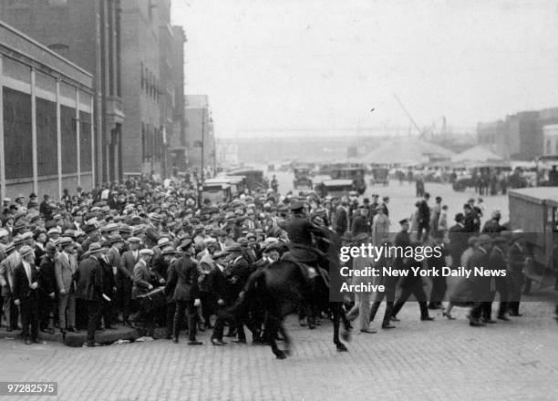 Crowd booing fascist delegates attending Washington, D.C. Conference are held in check by the police.